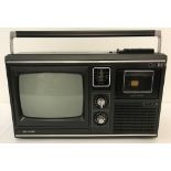 A 1980's Sharp 10P-18G integrated television/radio receiver/cassette player.