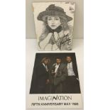 2 autographed pictures of 1980's Musical Artists.