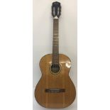 A vintage Terada 6 string acoustic guitar with steel reinforced neck.