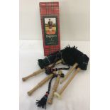 A boxed set of Junior playable bagpipes by Gold Brothers, Kirkcaldy, Scotland.