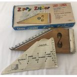 A boxed vintage "Zippy Zither" 12 string wooden instrument by F.M.T. Japan.