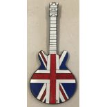 A red, white and blue union jack guitar shaped wall hanging mosaic mirror.