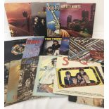 A collection of 15 assorted Rock Music vinyl LP's.
