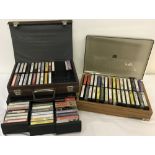 A quantity of vintage cassette tapes in 3 cases.