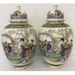 A pair of ornate oriental design temple jars.
