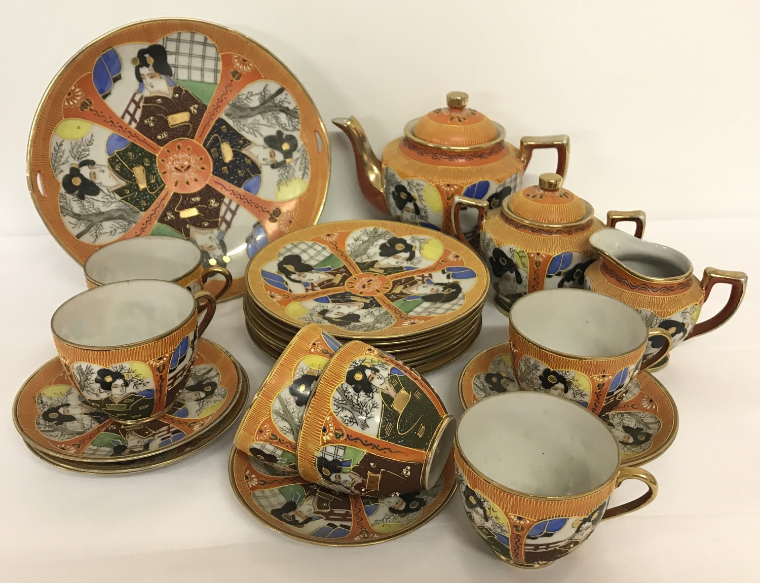 A quantity of vintage Japanese tea ware by Samurai China in orange with panel design.