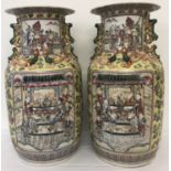 A pair of large ceramic yellow ground Cantonese vases of baluster form.