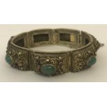 7 panel silver and jade bracelet with filigree detail.