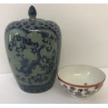 A vintage Chinese lidded jar with finial top and dragon decoration.