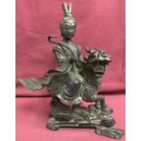 An antique bronze figure of a Chinese warrior riding a dragon horse (Chi Lin).