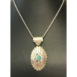 A sterling silver Native Indian design necklace set with turquoise.