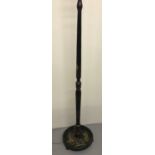 A Chinese black lacquer standard lamp with hand painted scene to base and detail to upright.