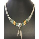 A Southwestern silver and turquoise Native American design necklace by Carolyn Pollock.