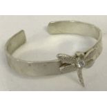 A 925 silver bangle with dragonfly detail to front.