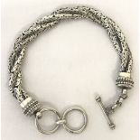 A twisted tri strand silver bracelet with T bar clasp.