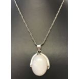 A white quartz in silver pendant on a 16 inch twist chain.