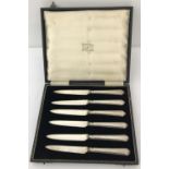 A boxed set of silver handled fruit knives hallmarked Sheffield 1925.