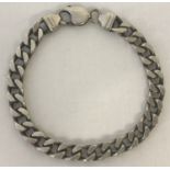 A silver heavy style curb chain bracelet.