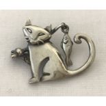 A 925 silver cat with a fishing rod brooch.