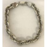 A silver decorative belcher chain bracelet with lobster clasp.