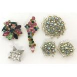 A vintage star shaped brooch set with clear stones by Weiss & Co.