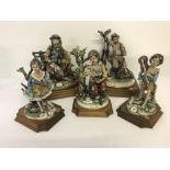 A collection of 5 large Capodimonte Bellinaso ceramic figurines mounted on wooden plinths.