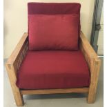 A modern wooden framed futon chair which converts into a bed.