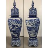 A very large Chinese blue and white ceramic lidded urn on a separate pedestal base.