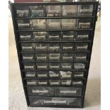 A 43 drawer cabinet with contents.
