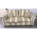 A modern 3 seater 'Duresta' settee with neutral coloured upholstery.