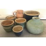 A collection of ceramic and terracotta garden plant and flower containers.