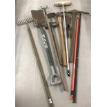 A quantity of vintage and modern long handled garden tools.