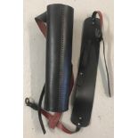 A black & red leather hand sewn quiver with integral strap.