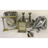 A collection of modern metal ware ornaments and clocks.