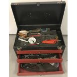 A modern metal 3 drawer lift up lid tool chest with contents.