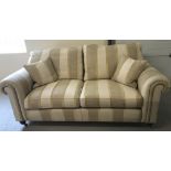 A modern 3 seater 'Duresta' settee with neutral coloured upholstery.