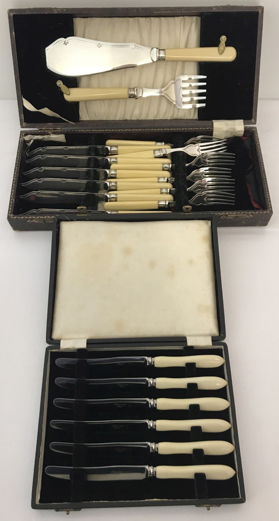 2 vintage boxed cutlery sets. A set of fish knives and forks, complete with servers