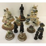 A collection of resin ornaments and figures.