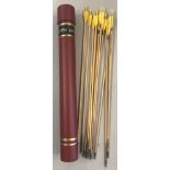 A set of 11 handmade wooden 27" steel-tipped arrows with yellow fletchings.