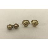 2 pairs of 9ct gold earrings. Decorative studs and seashells.