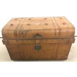 A vintage metal tin trunk with painted initials W.L. to top.