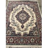 A floral decoration wool rug with fringed ends.