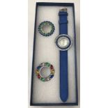 A boxed ladies dress watch with blue strap by Strada, complete with interchangeable face surrounds.