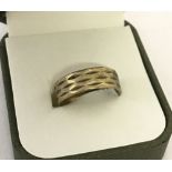 A vintage 9ct gold patterned wedding band.