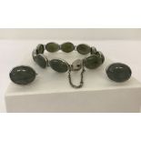 A vintage white metal bracelet set with 10 moss agate oval stones.