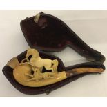 An antique cased Meerschaum pipe carved horse and hound detail to bowl.