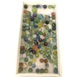 A collection of vintage marbles to include cat eye's, opaque's and swirlies.