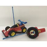 A vintage Fisher Price toy battery operated remote control car.