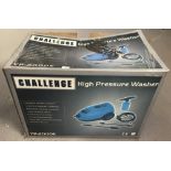 A boxed Challenge pressure washer, complete with instructions.