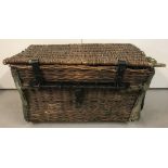 An early 20th century wicker laundry basket in original condition.